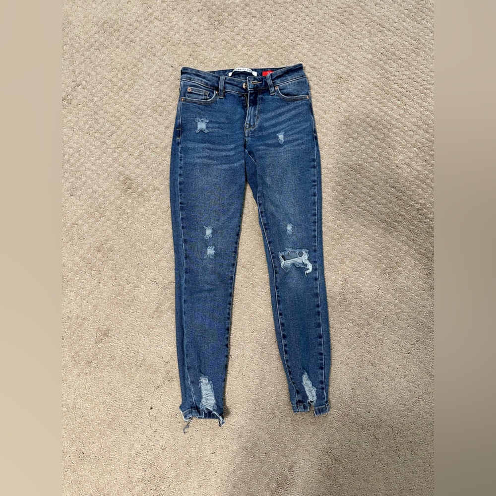 Medium to dark wash wears with rips